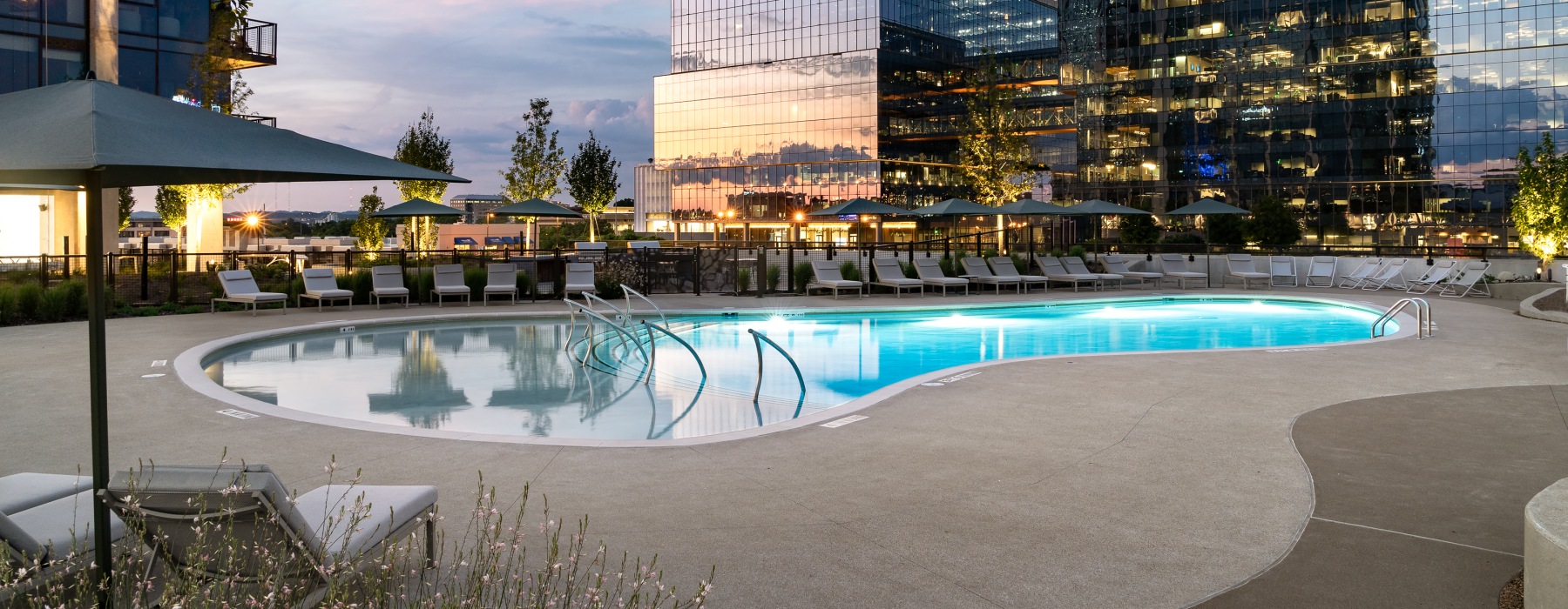 Resort-style swimming pool with lounge seating